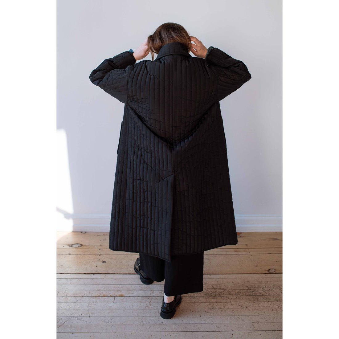 Nomia Quilted Overcoat in Black